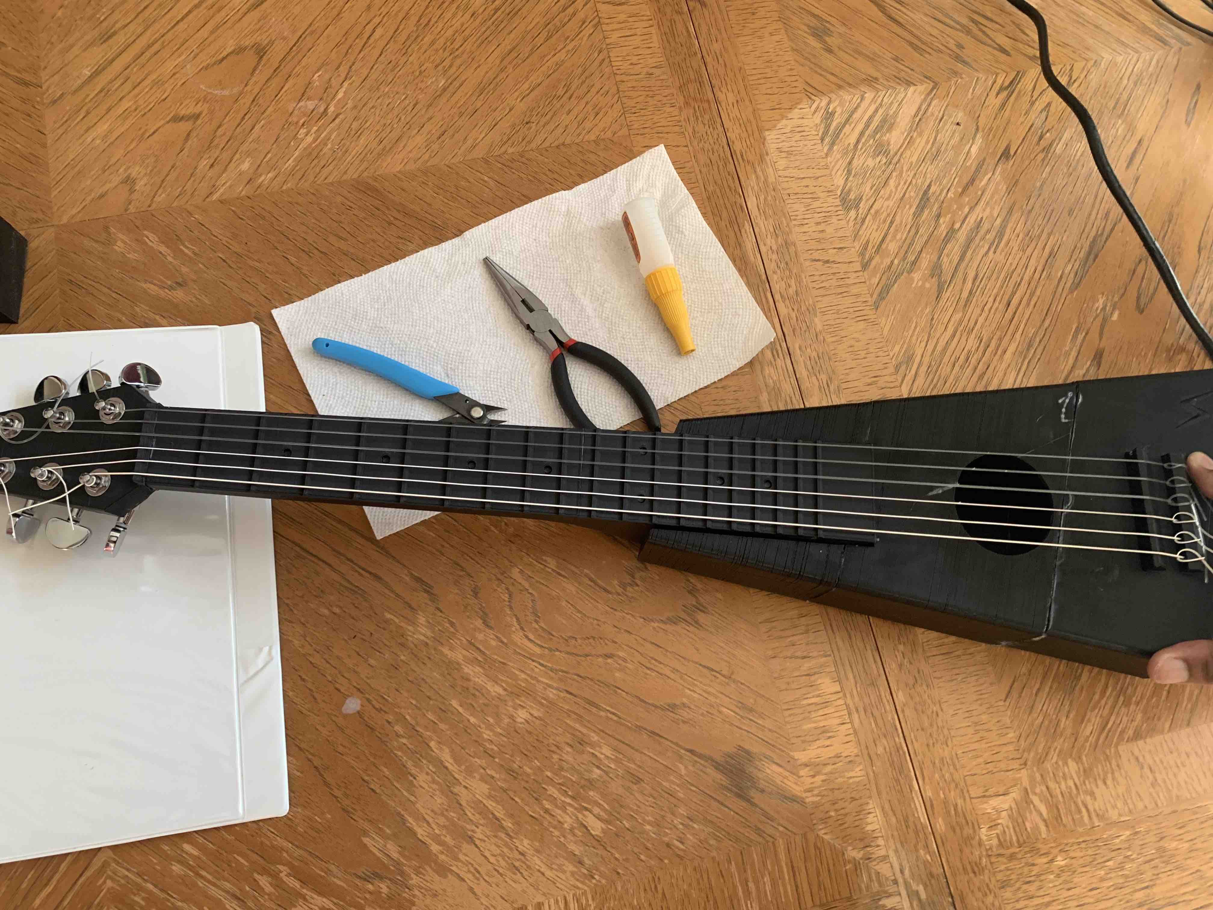 A photo of the originally printed guitar, with some of the flaws visible.